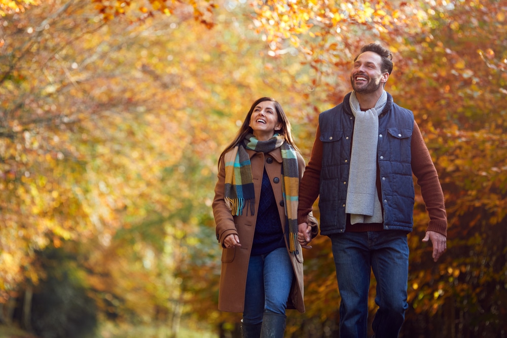 Couple on a fallingwater tour in the woods