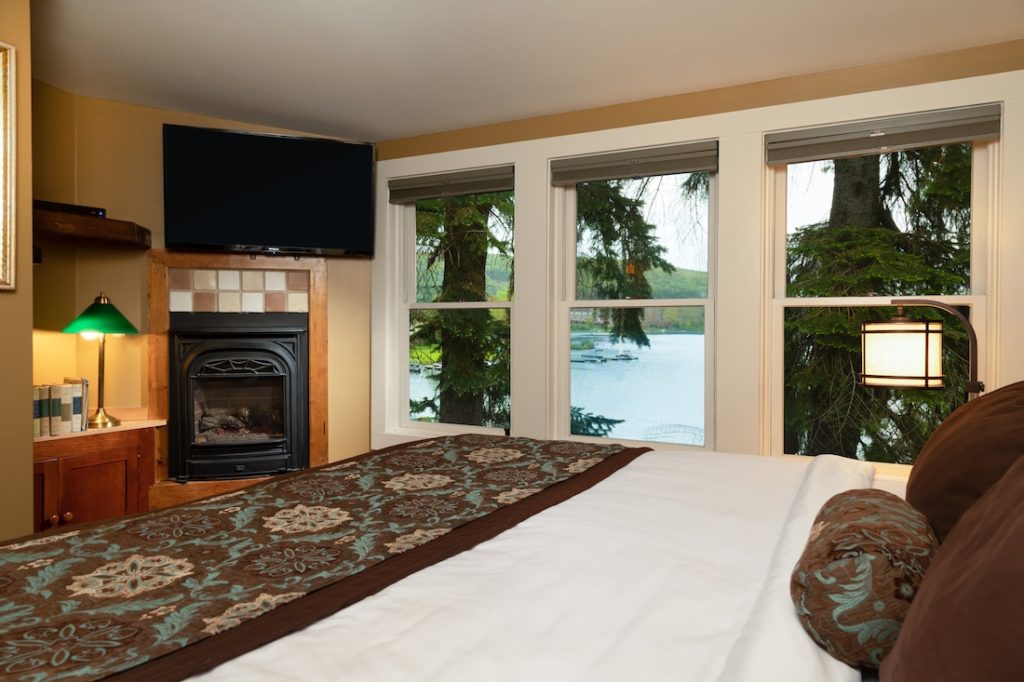 Deep Creek Restaurants, photo of Deep Creak Lake Hotel with a view of the lake, trees, and big comfortable bed 