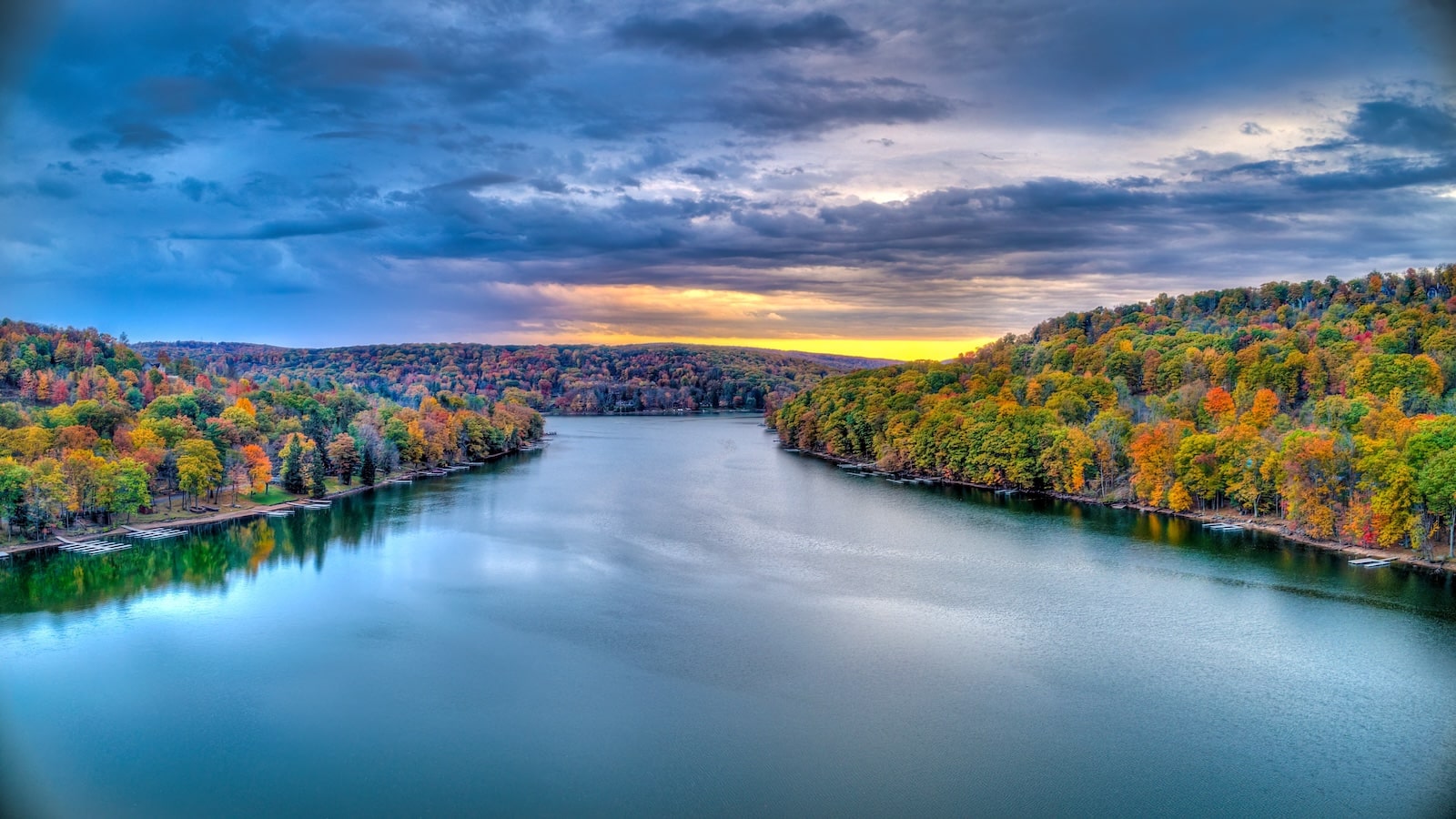 A colorful sunset at Deep Creek Lake during a cloudy evening in the Fall Season-one of the best things to do in Deep Creek MD