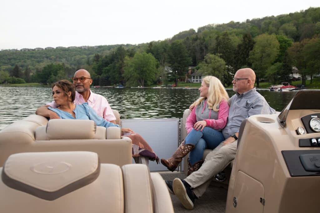 Deep Creek Lake Boat Rentals, photo of two couples out on a boat in Deep Creek Lake