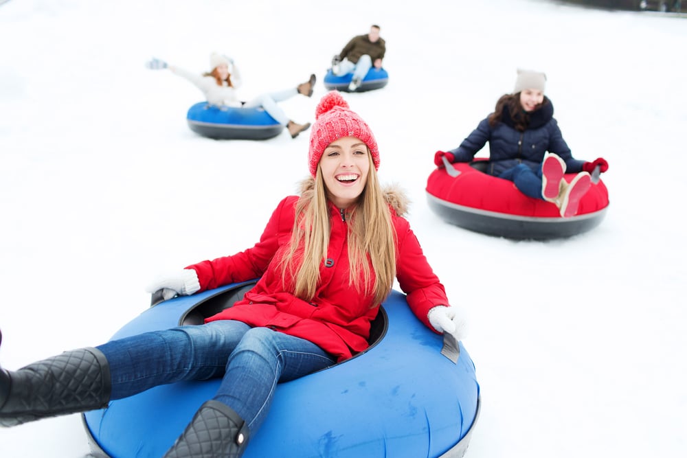Snow tubing in Maryland is fun for everyone, especially at Wisp Resort across the street from our Deep Creek Lake Hotel