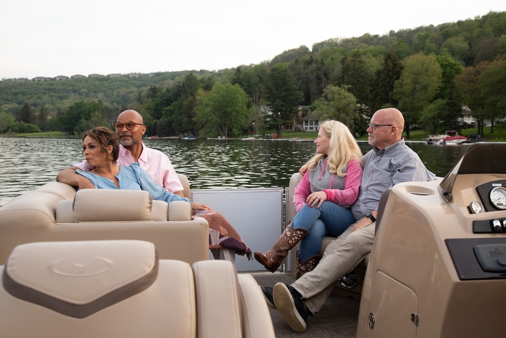 Deep Creek Lake Boat Rentals: Top Five Ways to Hit the Water. Photo of happy couples out on a pontoon boat ride